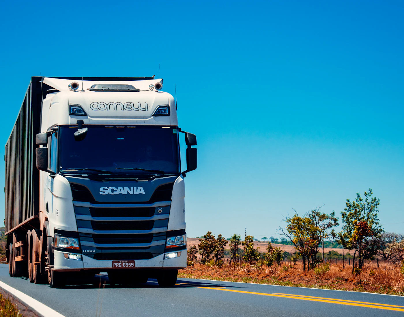 SwiftDrop delivery truck on a sunny highway