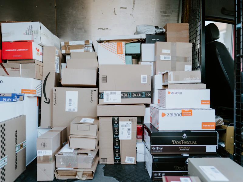 Parcels stacked in the back of a delivery van