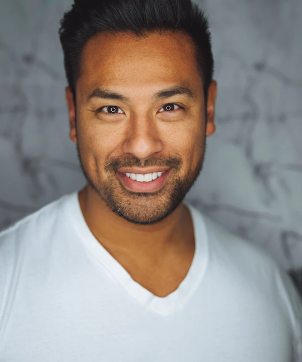 Portrait of Alex Rivera smiling
