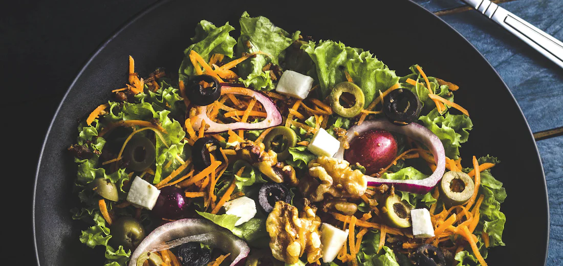 Seasonal garden salad with herbs, seeds and edible flowers